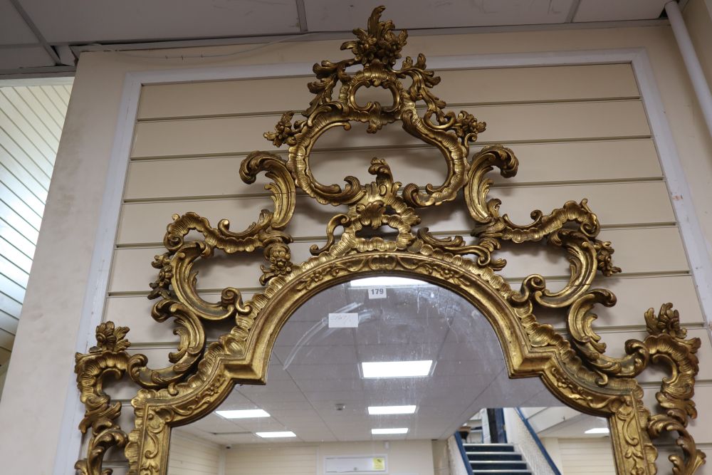 An 18th century style rococo gilt framed wall mirror, width 108cm height 184cm